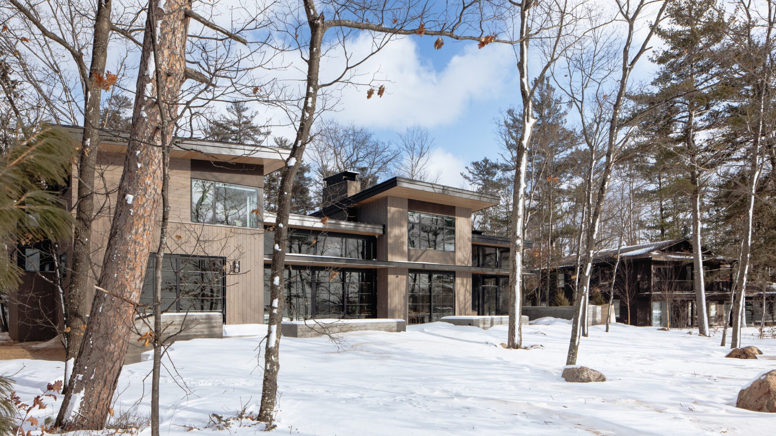 Bowers Harbor Lake House Exterior in Northern Michigan, Custom Home Design by BellCraft Architects