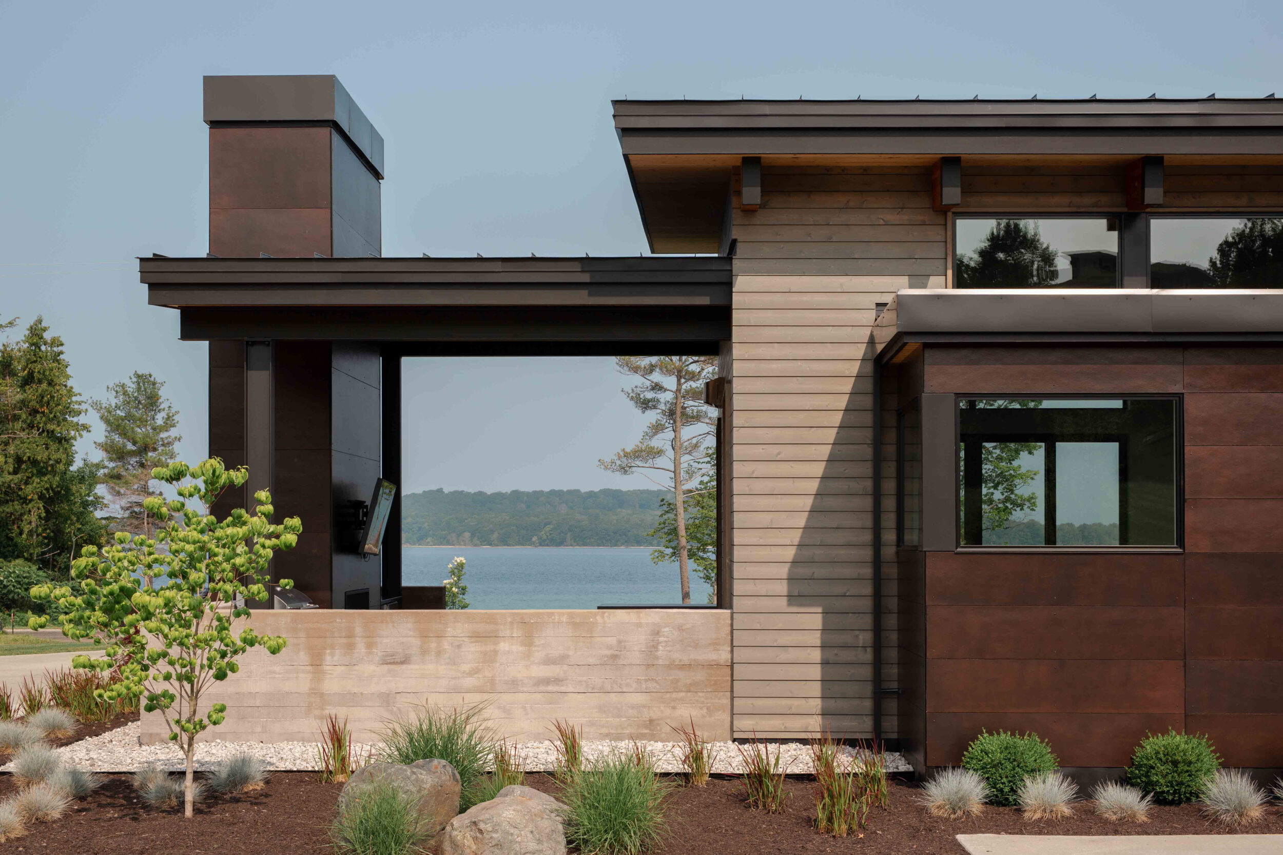 Mission West Lake House Covered Patio in Old Mission Peninsula, Michigan, Custom Home Design by BellCraft Architects