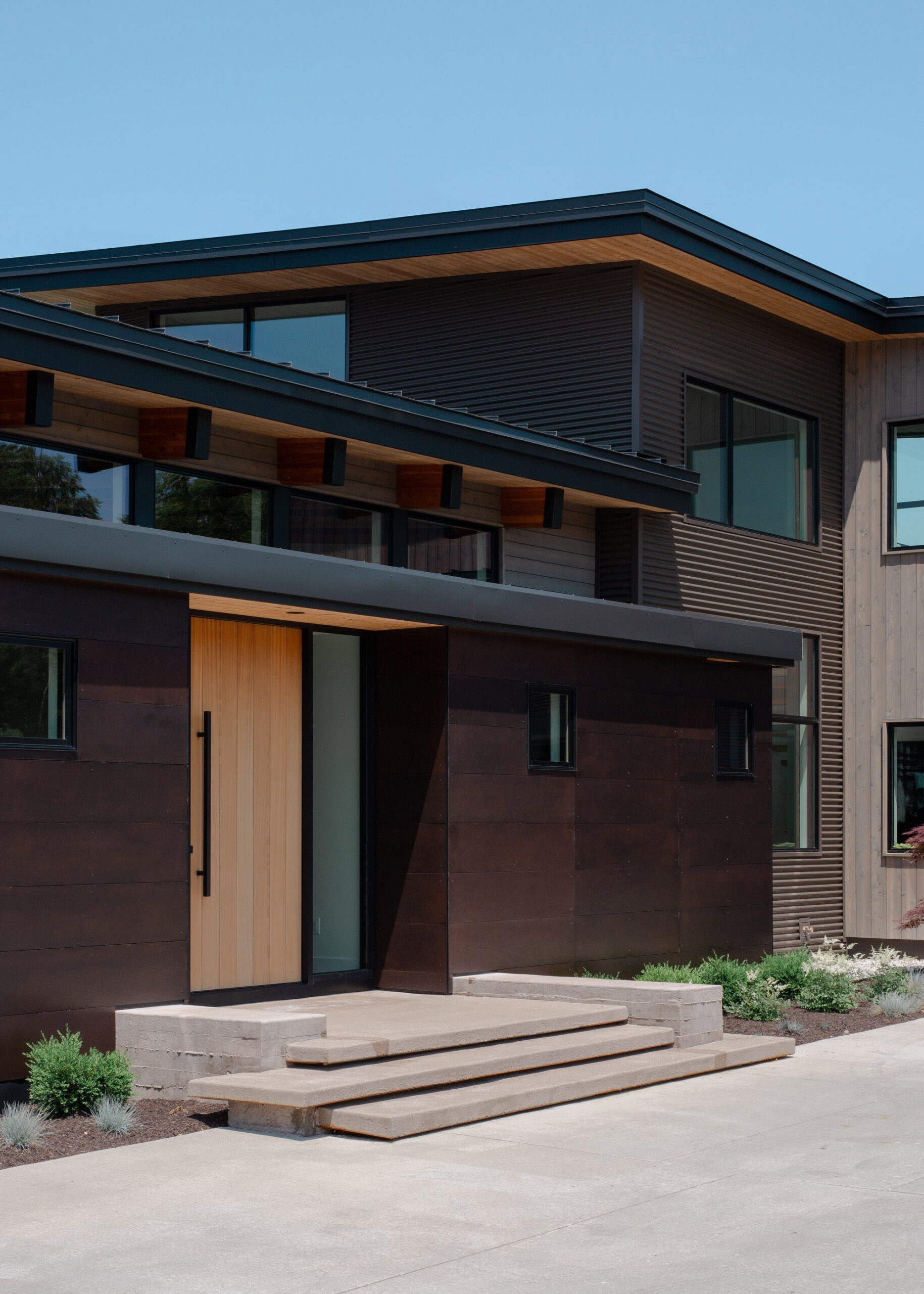 Home entry to Mission West Lake House Architecture Project by Bellcraft Architects